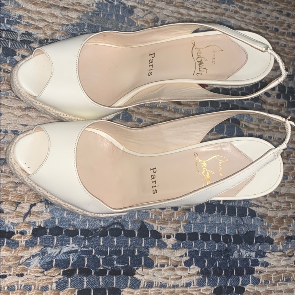 White Louboutin heels